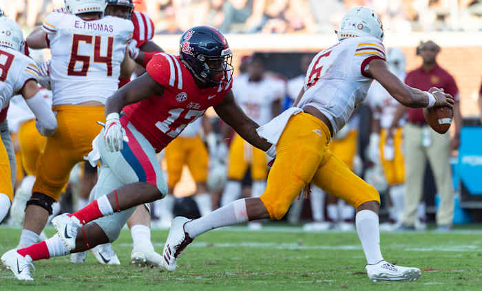 Oct 6, 2018; Oxford, MS, USA; Louisiana Monroe Warhawks quarterback Caleb Evans (6) runs away from Mississippi Rebels linebacker Willie Hibbler (17) during the second half at Vaught-Hemingway Stadium. Mandatory Credit: Vasha Hunt-USA TODAY Sports